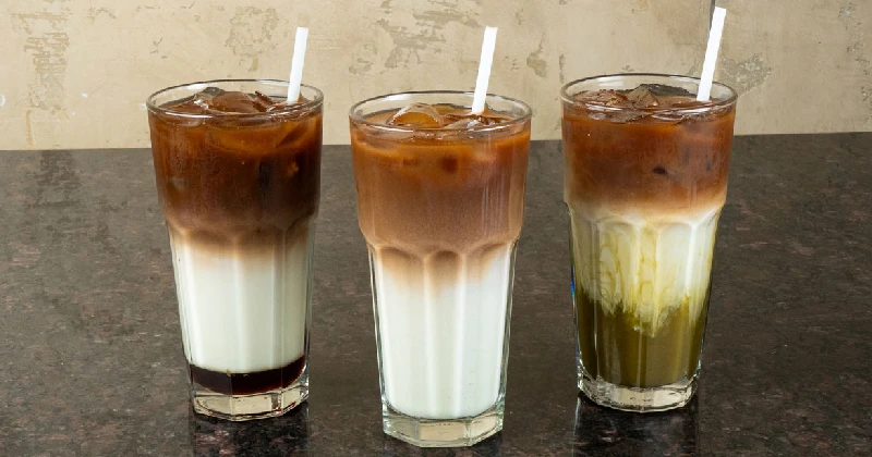 Dubai Chocolate Iced Latte, classic iced latte and Matcha Espresso drinks at Symposium Cafe
