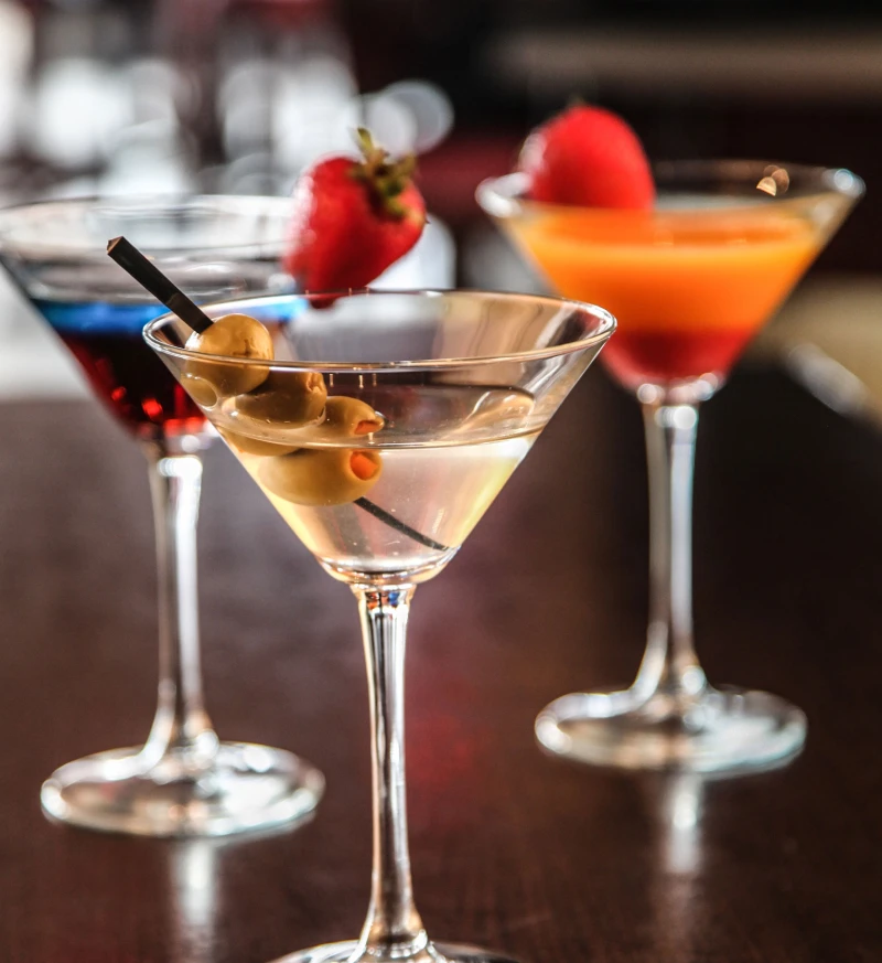Classic, Mango Passion and Purple Haze martinis, handcrafted cocktails at Symposium Cafe Restaurant and Lounge