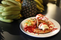 ontario restaurants dessert, hot waffle topped with fresh fruit and icecream at symposium cafe