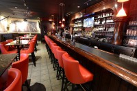 beautiful red leather seating custom bar  at symposium cafe