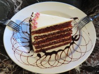 A decadent slice of Red Velvet Cake, part of the best selection of desserts in Ajax at Symposium Cafe near Rossland and 