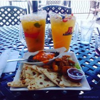 enjoying pitchers of sangria on the symposium cafe restaurants patio