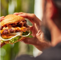 ontario restaurants serving a juicy double cheese burger at symposium cafe near me