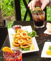 best tasting calamari patio appetizers cocktail mixed drinks symposium cafe restaurant