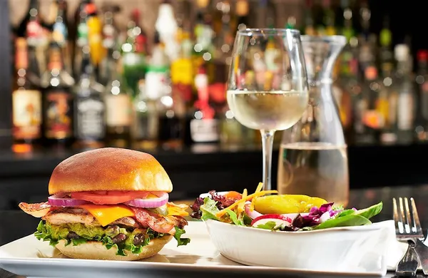 Quick lunch in Bolton with a juicy chicken sandwich, crisp toppings and a fresh side salad.