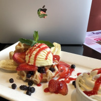 symposium cafe amazing desserts including the gaufrette, with ice cream banana strawberry 