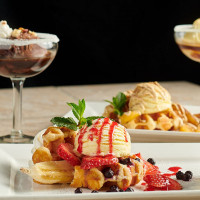 aurora dessert restaurant; eye popping Affogato, warm freshly made waffles with icecream and berries at symposium cafe