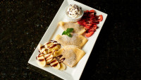 ontario restaurant desserts, nutella_strawberry_banana_crepes topped with whipped cream, dessert menu symposium cafe
