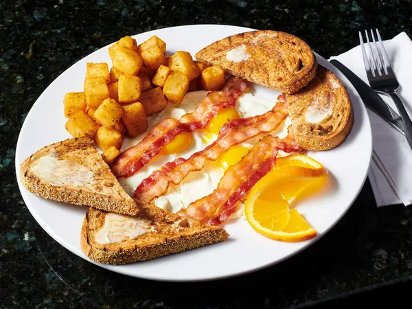 Classic Ontario all-day breakfast with eggs, crispy bacon, golden home fries and warm toast.