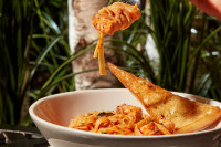 A delicious gourmet pasta dinner at Symposium Cafe Restaurant Aurora, featuring our 50% off Tuesday pasta night special 