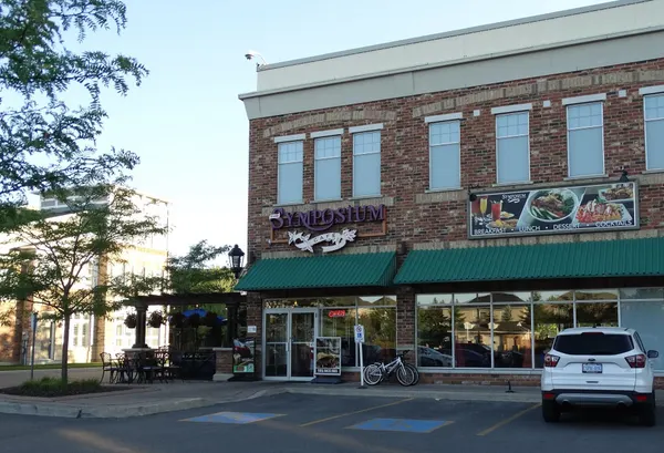 Popular Symposium Cafe Restaurant Milton exterior with a welcoming entrance in Derry Heights.