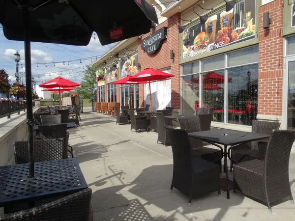 Cambridge restaurant exterior with welcoming outdoor dining near Can-Amera Parkway and Highway 401.