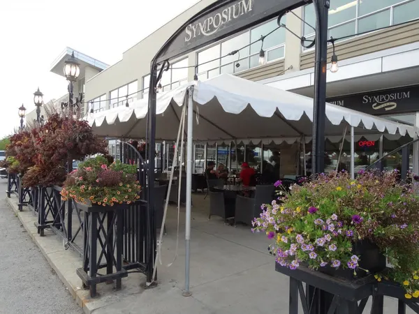 Stoney Creek seasonal patio at Symposium Cafe with relaxed outdoor dining and comfortable restaurant seating.