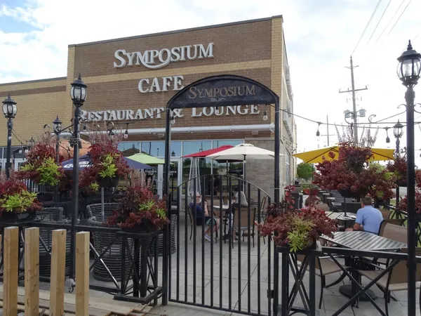 Ancaster seasonal patio at Symposium Cafe with comfortable outdoor seating for breakfast, lunch and dinner.
