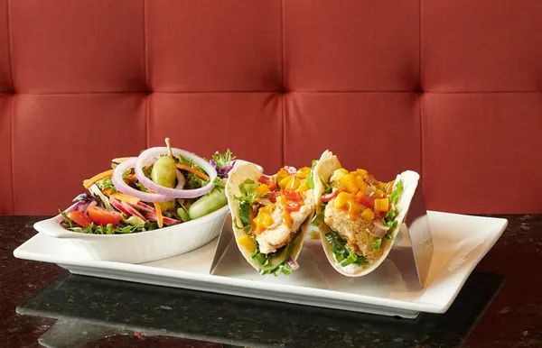 Fish tacos with fresh garden salad at Symposium Cafe Restaurant Oakville