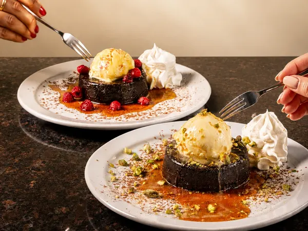 A favorite among dessert spots near me featuring rich chocolate lava cakes with whipped cream at Westside Marketplace in Waterloo Ontario.