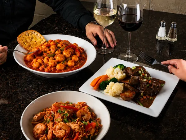 Bolton Ontario Dinner for Two Thursday special featuring hearty dinner entrées with red and white wine at Symposium Cafe