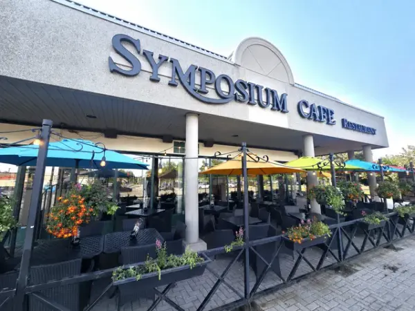 Oakville Ontario restaurant exterior and seasonal patio in Glen Abbey near Upper Middle Road and Third Line showcasing outdoor dining at Symposium Cafe.