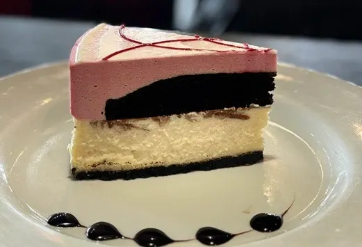 Oakville Ontario dessert spot showcasing our New York Style Cheesecake part of our decadent desserts menu at Symposium Cafe.