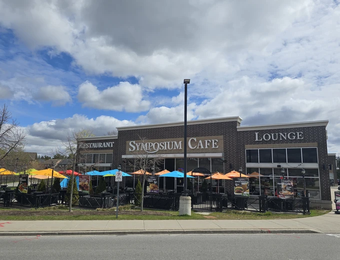 Cozy outdoor dining area of Symposium Cafe Restaurant Ajax family restaurant showing the beautifully designed and cozy patio, located on corner of Salem Road & Rossland Road