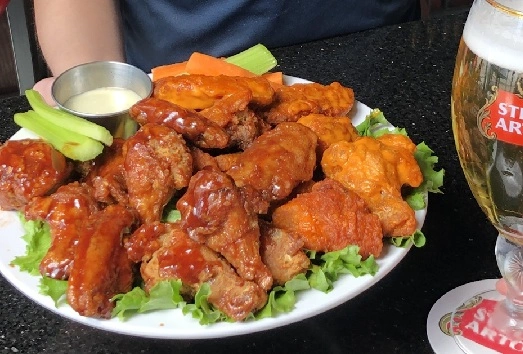 Plump and tender chicken wings at Symposium Ancaster