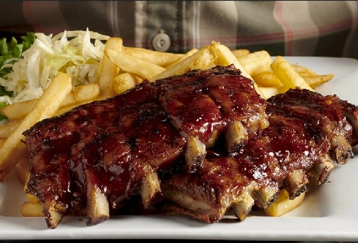 BBQ Ribs Dinner with fries and coleslaw at Symposium Restaurant Aurora