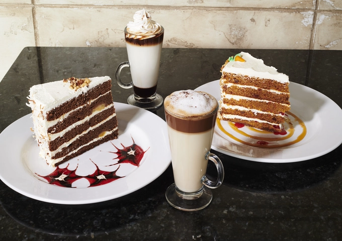 Cakes, waffles and desserts at Symposium Cafe Restaurant Barrie, a popular Oakville dessert place