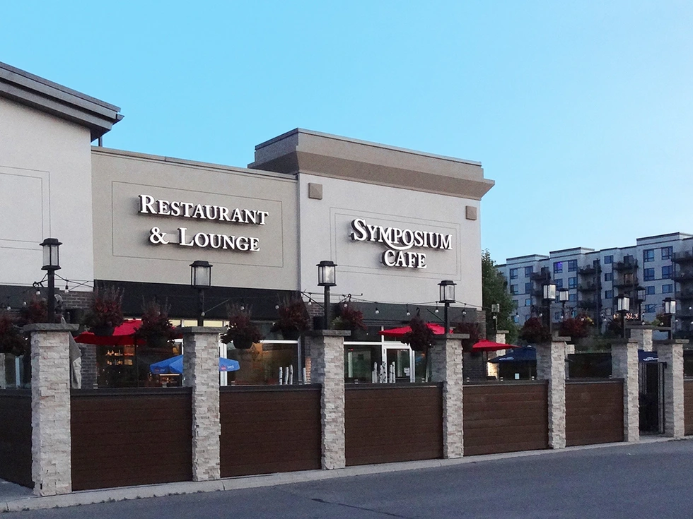 Symposium Cafe Restaurant Barrie exterior and cozy patio leading to our photo gallery with breakfast, desserts, drinks, dining room, patio, and food photos