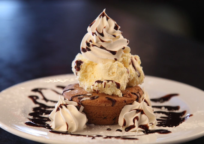 Cakes, waffles and desserts at Symposium Cafe Restaurant Bolton, a popular Bolton dessert place