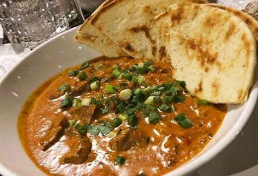 Butter Chicken Bowl with pita bead at Symposium Restaurant Bolton