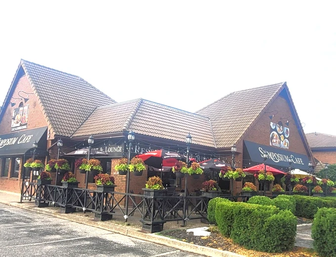 Symposium Cafe Restaurant Brantford family restaurant exterior facade and outdoor patio seating located on located in the Comfort Inn Hotel on King George Road, just south of the Highway 403.