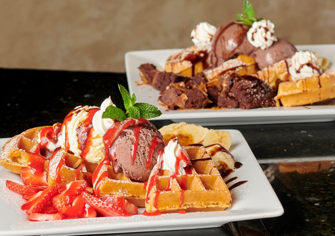 Cakes, waffles and desserts at Symposium Cafe Restaurant Cambridge, a popular Cambridge Ontario dessert restaurant