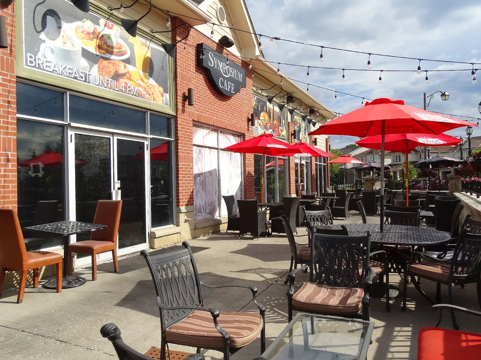 Symposium Cafe Restaurant Cambridge exterior and cozy patio leading to our photo gallery with breakfast, desserts, drinks, dining room, patio, and food photos