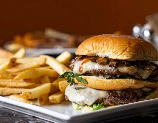 Mushroom double swiss burger and fries at Symposium Restaurant Cambridge