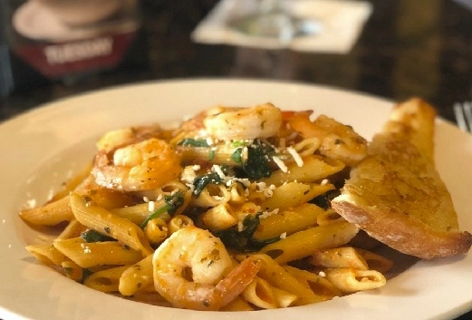 Pasta Special with shrimp and garlic toast at Symposium Restaurant Cobourg