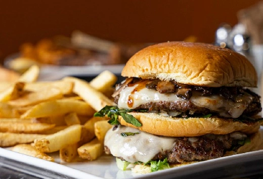 Mushroom Double Swiss Burger with Fries at Symposium Restaurant Georgetown