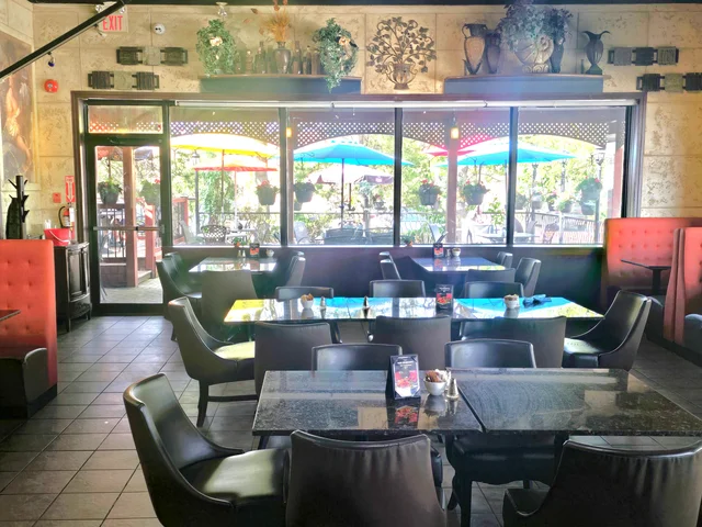 Cozy upscale-casual dining room at Symposium Cafe Restaurant Guelph, a warm neighbourhood restaurant across from Stone Road Mall and near the University of Guelph