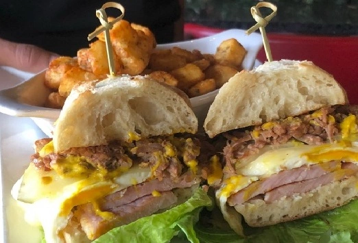 Breakfast Cuban Sandwich with breakfast potatoes at Symposium Restaurant Guelph