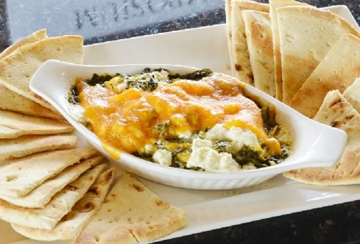 Spinach Dip Appetizer with feta, cheddar, spinach and pita at Symposium Guelph Restaurant