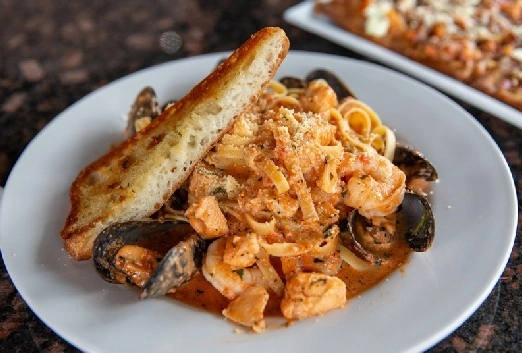 Seafood Specials Pasta Dinner at Symposium Keswick Restaurant