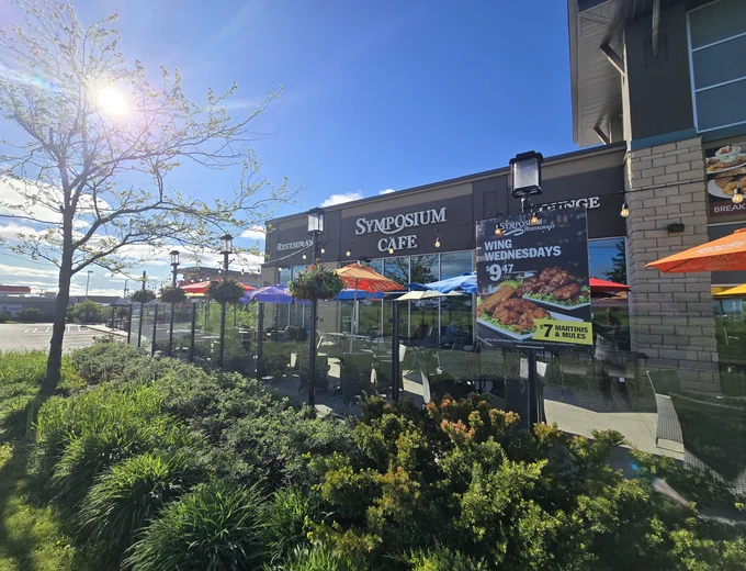 Symposium Cafe Restaurant Lindsay family restaurant exterior facade and outdoor patio seating located on Kent Street directly beside the LCBO