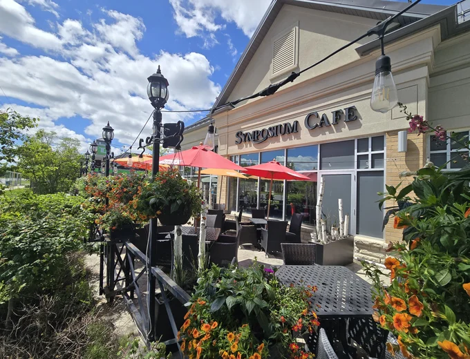 The beautiful outdoor patio at Symposium Cafe Restaurant Markham—your go-to spot in Angus Glen for summer cocktails, family lunch, or dinner under the stars.
