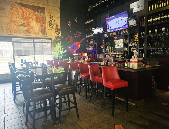 Stylish interior of Symposium Cafe Restaurant Milton showing the cozy cafe area, Renaissance-style decor, and comfortable seating for large groups and families located on 611 Holly Avenue off Derry Road in Derry Heights.