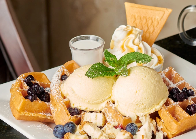 Cakes, waffles and desserts at Symposium Cafe Restaurant Oshawa, a popular dessert spot in North Oshawa.
