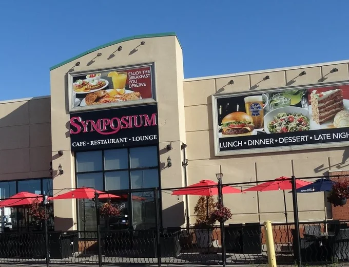 Symposium Cafe Restaurant Woodbridge family restaurant exterior facade and outdoor patio seating located at the Colossus Centre on Highway 7 & Weston Road and nearby Cineplex Cinemas across from Fortinos.