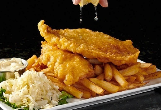 Fish and Chips with coleslaw at Symposium Cafe Restaurant Woodbridge, a family restaurant serving up gourmet comfort food for lunch, dinner and late night dining.