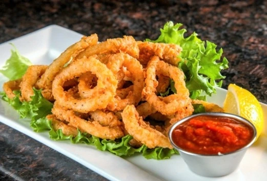 Fried Calamari appetizer at Symposium Cafe Restaurant Woodbridge, a family restaurant serving up gourmet comfort food for lunch, dinner and late night dining.