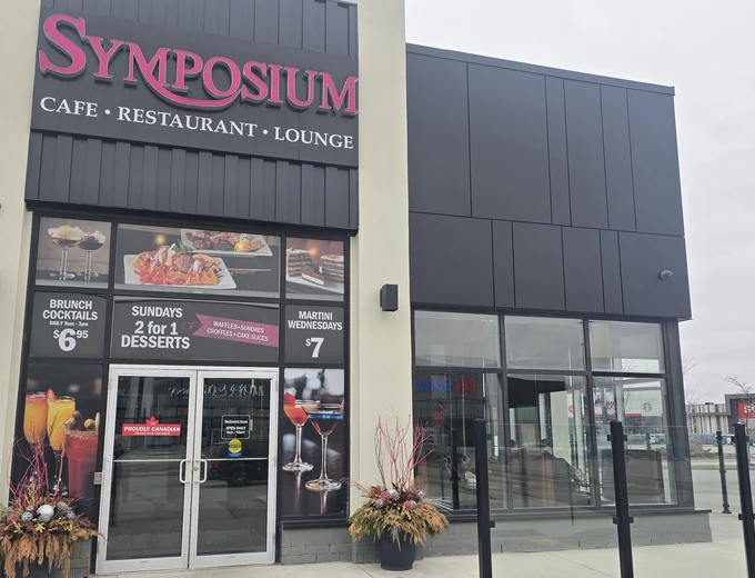 Symposium Cafe Restaurant Woodbridge family restaurant exterior facade and outdoor patio seating located at the Colossus Centre on Highway 7 & Weston Road and nearby Cineplex Cinemas across from Fortinos.
